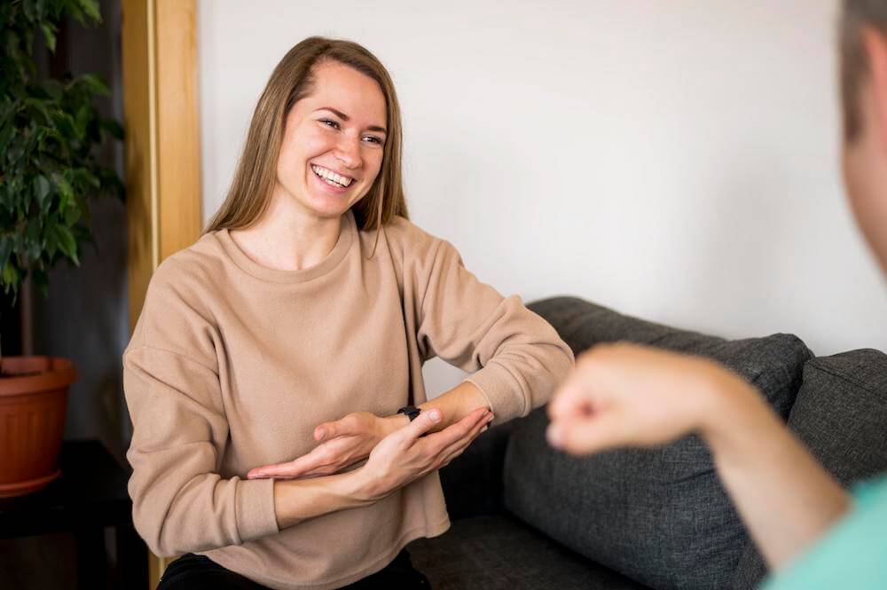 Happy woman smiling when talking to her therapist