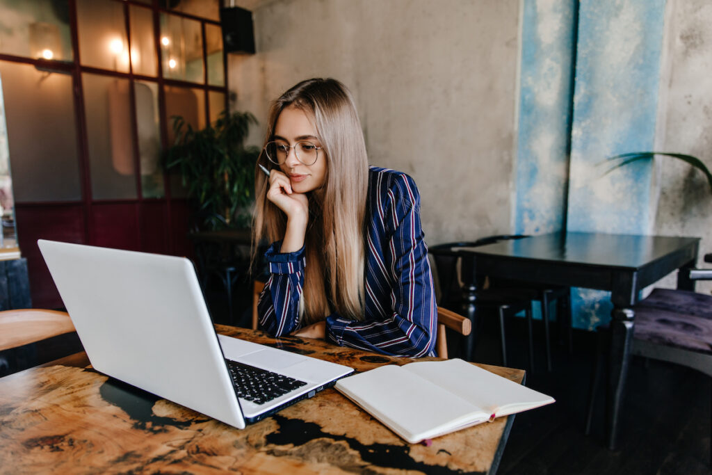 Woman writing a business plan for salon