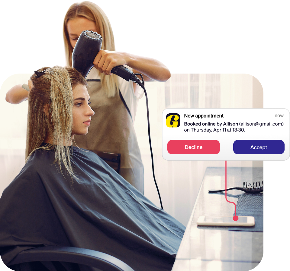 Woman working in a salon accepting appointments from clients online